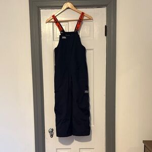 Helly Hansen Kids Navy ski bibs with orange Straps